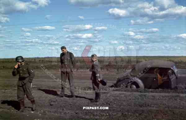 German soldiers taking smoking break beside staff car, Meissen Division,  94.Inf. Div, Swords, Lutsk, Ukraine. 1941.