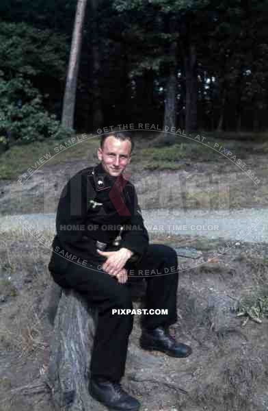 German Wehrmacht Panzer officer in black panzer uniform with belt buckle, forest, Frankfurt, 1942.