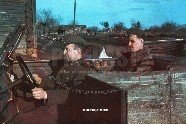 German Wehrmacht staff driver driving his commanding officer in a Volkswagen Kubelwagen. Chernihiv Ukraine 1943