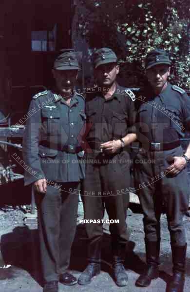 German wehrmacht supply officers in tropical uniform, caps, boots, smoking, repair truck, Anzio Italy 1944.