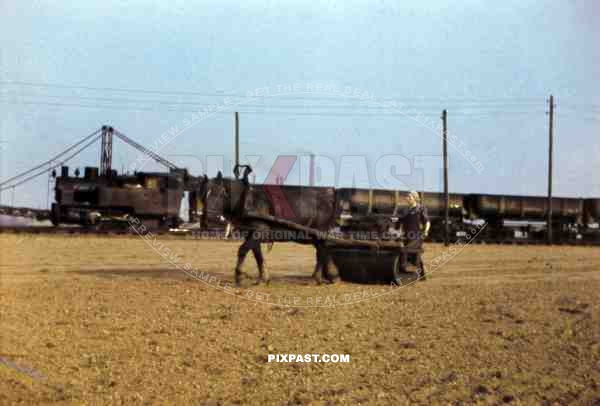 horse drawn roller and coal train in Weisweiler, Germany ~1938