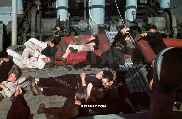 Kriegsmarine seamen resting on the deck of a warship at the french Atlantic coast 1941