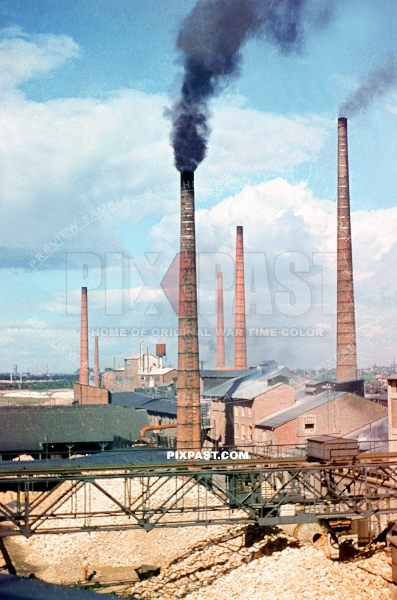 Large cement factory in Austria 1939. Large smoke stacks chimneys. Klagenfurt am Worthersee