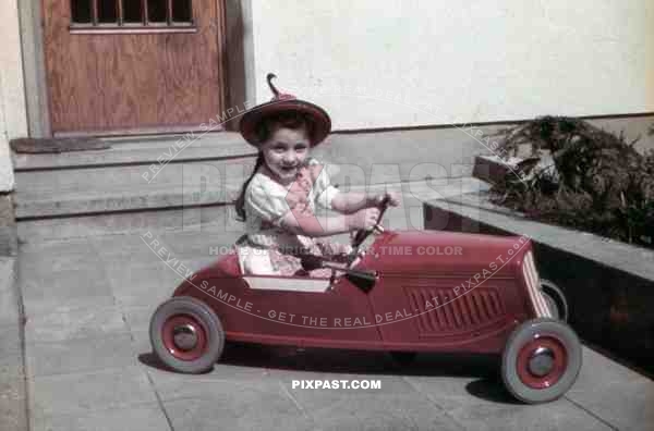 little girl with pedal car, Germany 1939