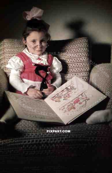 little girl with reading glasses and a childrenÂ´s book, Germany 1938