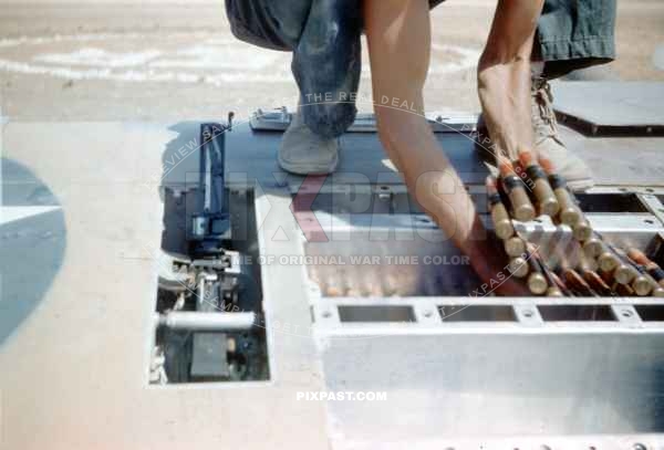 Loading ammunition into a Spitfire Mk V (trop) WZ-J JL237. 309th Fighter Squadron of the 31st Fighter Group. Sicily 1943.