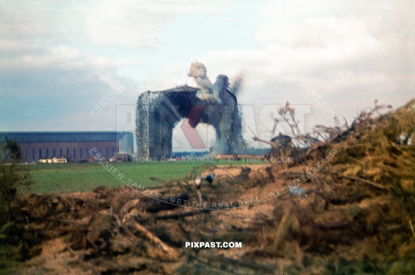 Luftwaffe ground crew demolishing old Zeppelin Hall in France 1942. Airfield was for the Jagdgeschwader 2 Richthofen.