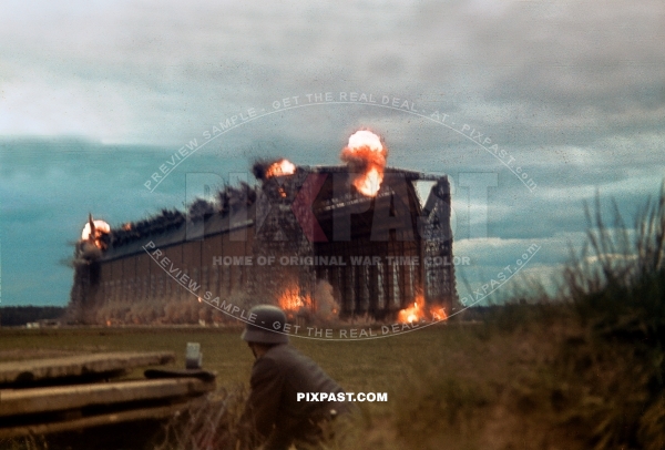 Luftwaffe ground crew demolishing old Zeppelin Hall in France 1942. Airfield was for the Jagdgeschwader 2 Richthofen.