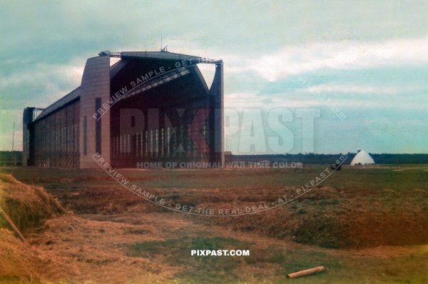 Luftwaffe ground crew demolishing old Zeppelin Hall in France 1942. Airfield was for the Jagdgeschwader 2 Richthofen.