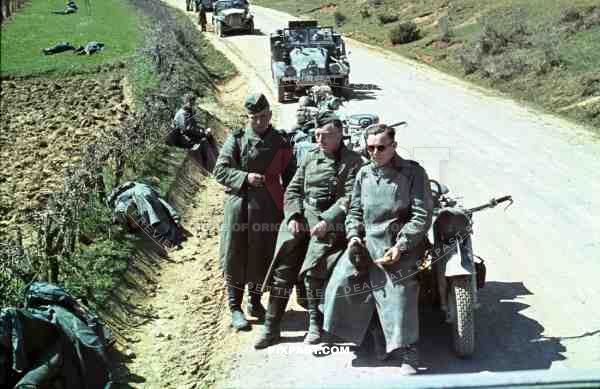 Motorbike messengers rest on dusty road, Russia 1941