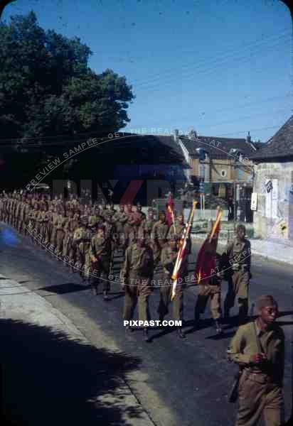 negro soldiers on Bastille day parade in Langres, France 14th July 1945