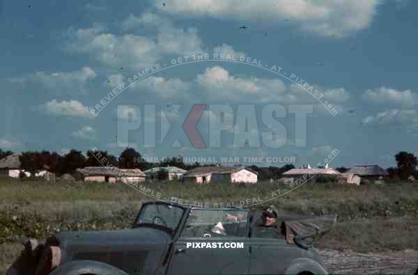 oddicer in car in russia inspecting