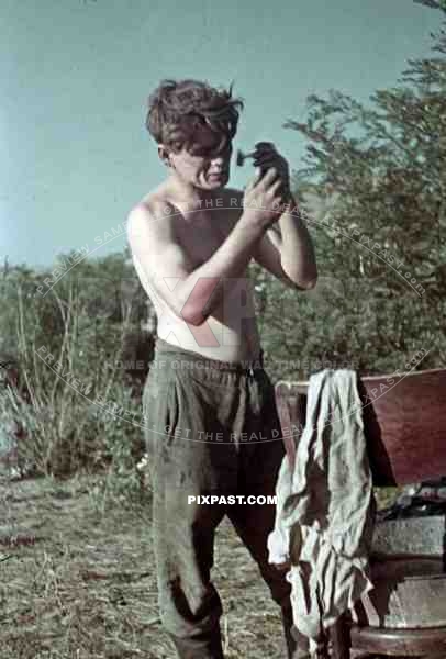 Panzer soldier shaving in Ukrainian Village, Krim, Kretsch, 1942, 22. Panzer Division.