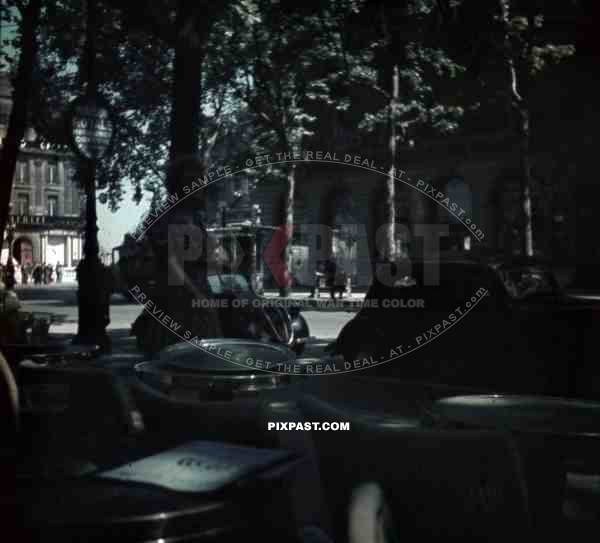 Paris France 1940 coffe shop street life old cars traffic women sunglasses