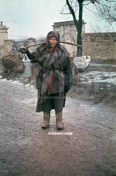 peasant woman in winter clothes and grave boots in Russia 1944