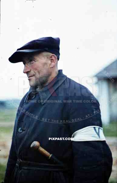 Polish Ghetto Guard in blue jacket. Armband with blue V. and police baton. Kriegsberichter Franz Krieger