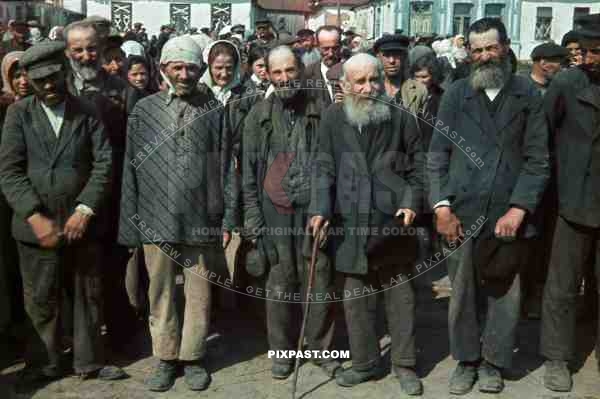 Russian Jewish civilians lined up in Chaltyr market square and photographed by a german soldier. Rostov Oblast Russia 1942