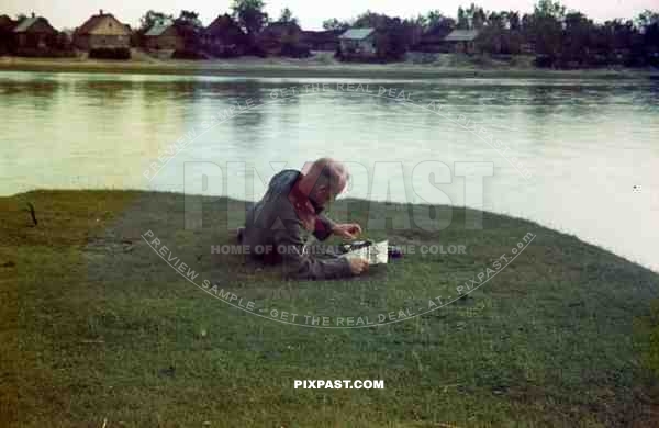 soldier reads newspaper camera france 1940