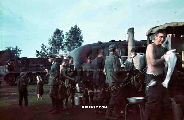 soldiers eating washing halftrack