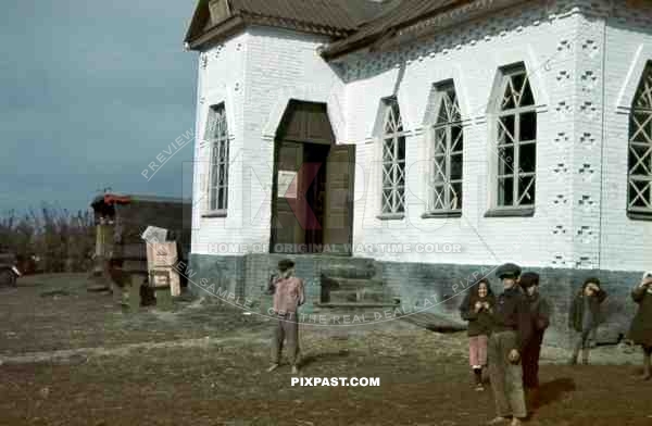 Tokari, Ukraine, 1941, Primary School. Children playing beside German army supply truck. 94. Infantry Division.