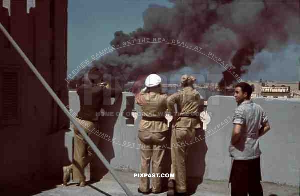 Tripoli harbour in Libya, 1942. Destroyed Burning german transport ships after Allied air attack