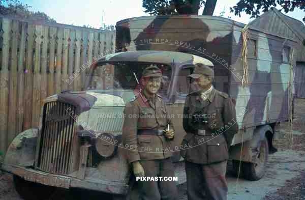 two Wehrmacht officers having a break in Potschow, Russia 1944