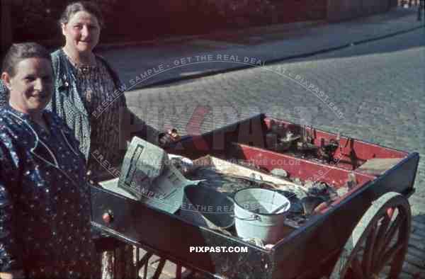 two women selling fish in a push cart in Kiel, Germany 1939