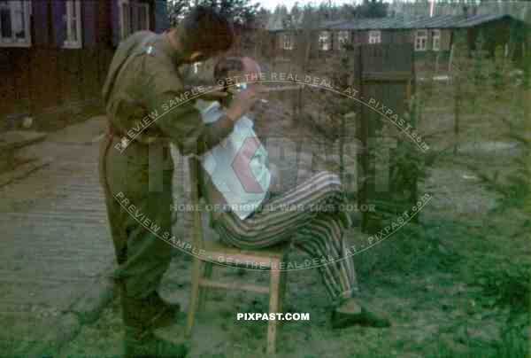 Wehrmacht soldier gets a haircut at the R.A.D. camp in Mitschurino,  Russia 1941