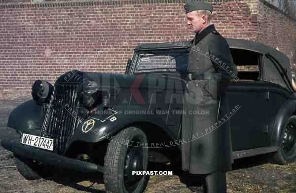 Wehrmacht soldier in NiederauÃŸem (Von-Galen-Weg), Germany 1940. Adler 2 Liter Cabriolet EV 1938. 4th Panzer Division.