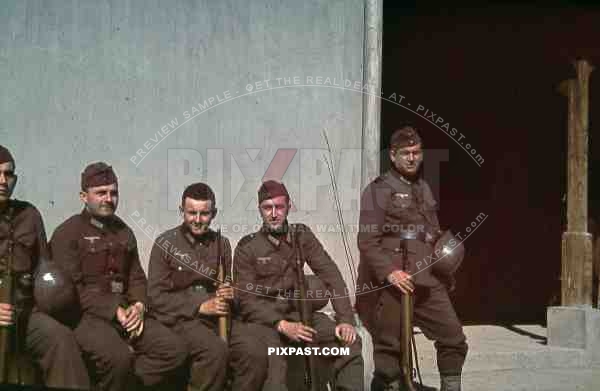 wehrmacht soldiers helmets wait for lunch