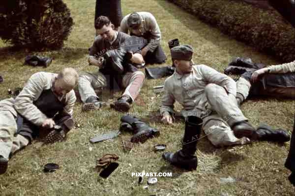 Wehrmacht soldiers of the IR 103 polishing shoes in Bautzen, Germany 1939