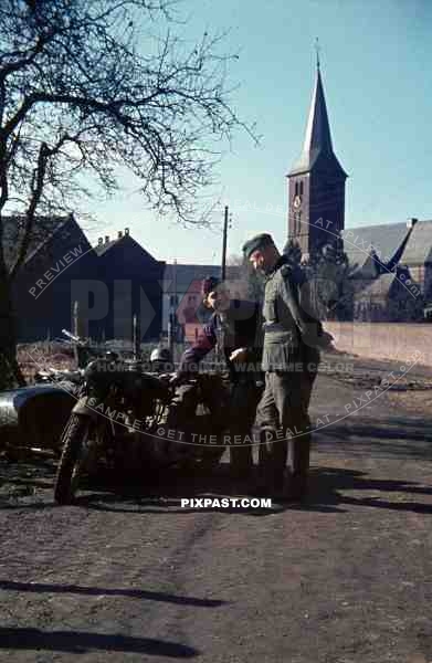 Wehrmacht soldiers with motorbike in Niederaussem, Germany 1940