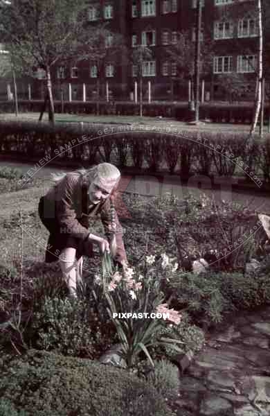 WW2 Color German Hitler Youth BDM girl in uniform flowers Bremerhaven apartment building garden