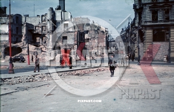 WW2 color Luftwaffe officer Bindewald in destroyed bombed city town Krakow Poland 1940