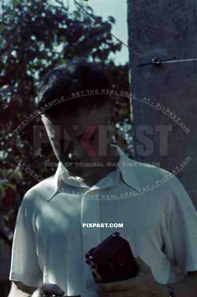 Young Austrian man with photo camera, Summer 1939. white shirt, became war reporter in Russia, Kriegsberichter,