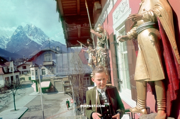 Young boy in Bayerische Tracht, binoculars on the balcony of Hotel. Garmisch Partenkirchen Bavaria Germany 1939