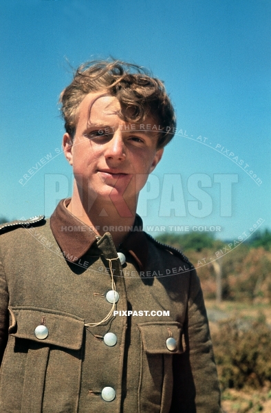 Young German man in his RAD Reichsarbeitsdienst uniform. Building and repairing roads in Russia 1942