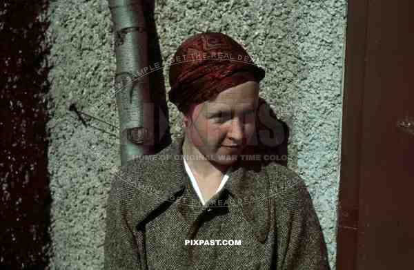 Young German woman 1936 in American style 20s silk cap and jacket.